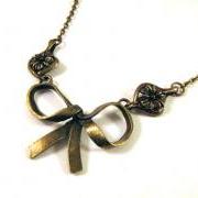 Bronzed bow necklace jewelry with flower charm connectors